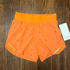 Lululemon Hotty Hot Short 4” Logo, orange, size 4 women’s